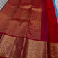 Close view of red zari woven border with dense gold pattern on Kanchipuram silk