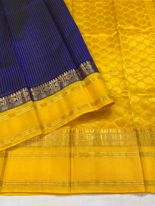 Deep Blue Checked Body with Zari Highlights
Radiant Yellow Pallu with Golden Circular Motifs
Traditional Zari Border with Intricate Weaves
Silk Mark Certified • Ready to Ship • Free USA Shipping