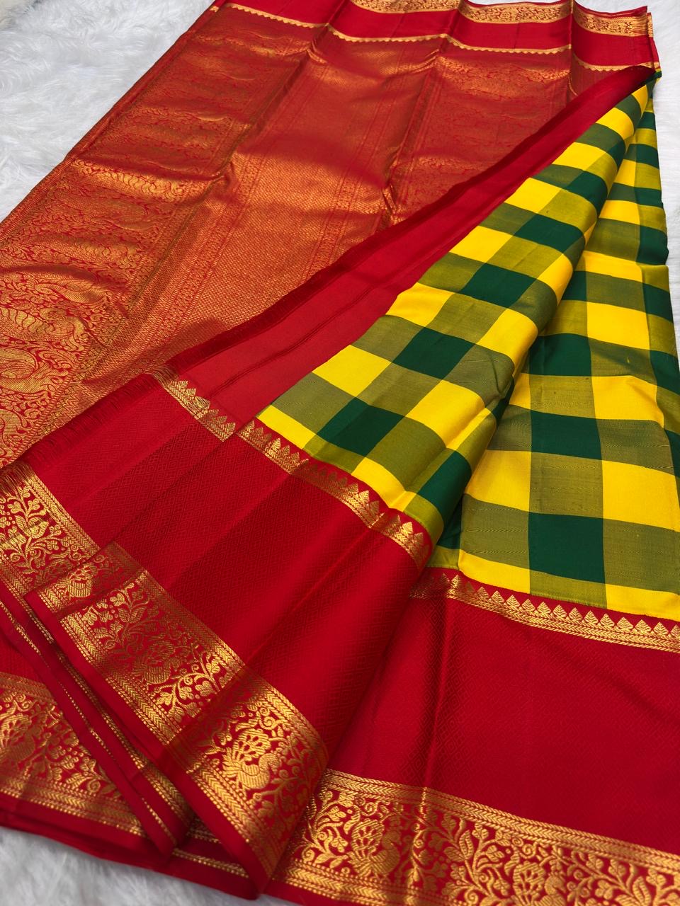 Green and Yellow pure silk Kanjipuram saree, Kanchi Kattam weave with Pillar-Box Red border — folded view