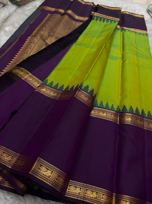 Sivakami ✨
Royal Aubergine & Parrot-Green Korvai Kanchipuram Pure Silk Saree
With Purple Thazampoo Reku Crown & Rettapet Mayil Zari Border
Grand Gold Brocade Pallu with Temple-Inspired Detailing
Silk Mark Certified | Handloom Heirloom Elegance