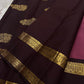 Contrast coffee pallu close-up with gold zari woven motifs and maroon body glimpse