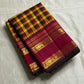 Manjal Maroon Kattam – Pure Kanchipuram Silk Saree
Mustard & Maroon Body with Traditional Multi-Color Checks
Korvai Borders with Floral-Star Zari & Temple Tips
Grand Maroon Pallu with Gold Zari Stripes & Tassels
Silk Mark Certified | ships in 2 weeks