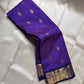 Vadamalli Yaanai – Pure Kanchipuram Silk Saree
Royal purple body with delicate gold zari floral medallion buttas
Ornate yaanai procession borders with vine detailing in zari
Ships in two weeks silk mark certified
