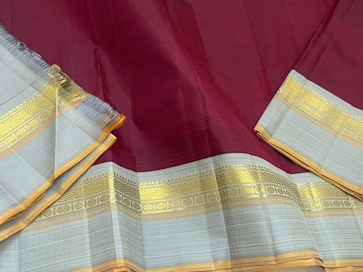 Deep Ruby Dove Grey – Pure Silk Kanchipuram Saree
Korvai Weave with Elegant Contrast Borders
Golden Zari detailed Pallu
Silk Mark Certified | Fall & Pico Done | Blouse Stitching Available ($30)