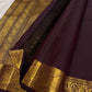 Traditional Kanchipuram silk saree in deep aubergine brown with heritage Annapakshi zari craftsmanship