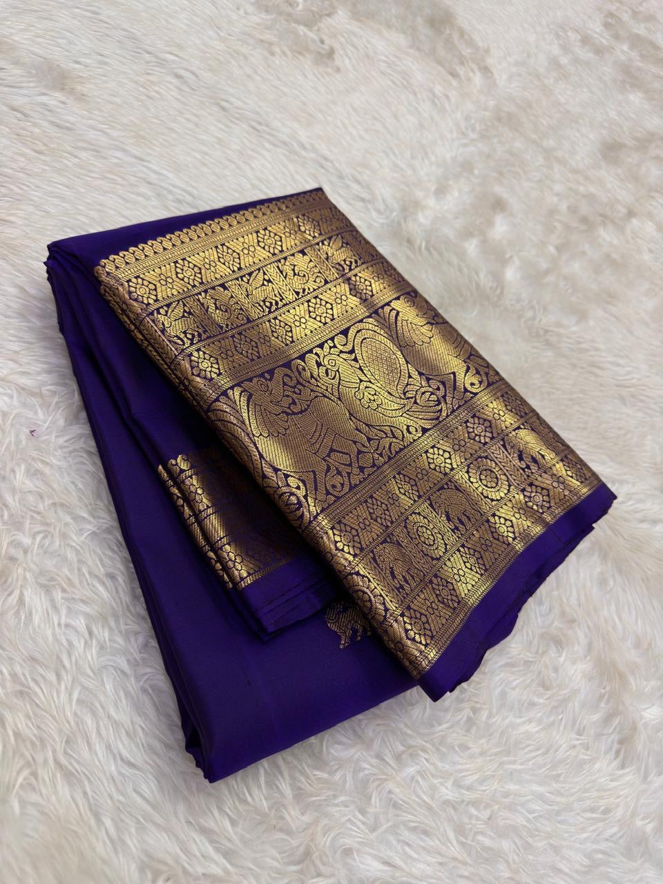 Authentic Kancheepuram silk saree with midnight blue body and Yazhi guardian motif heirloom weaving