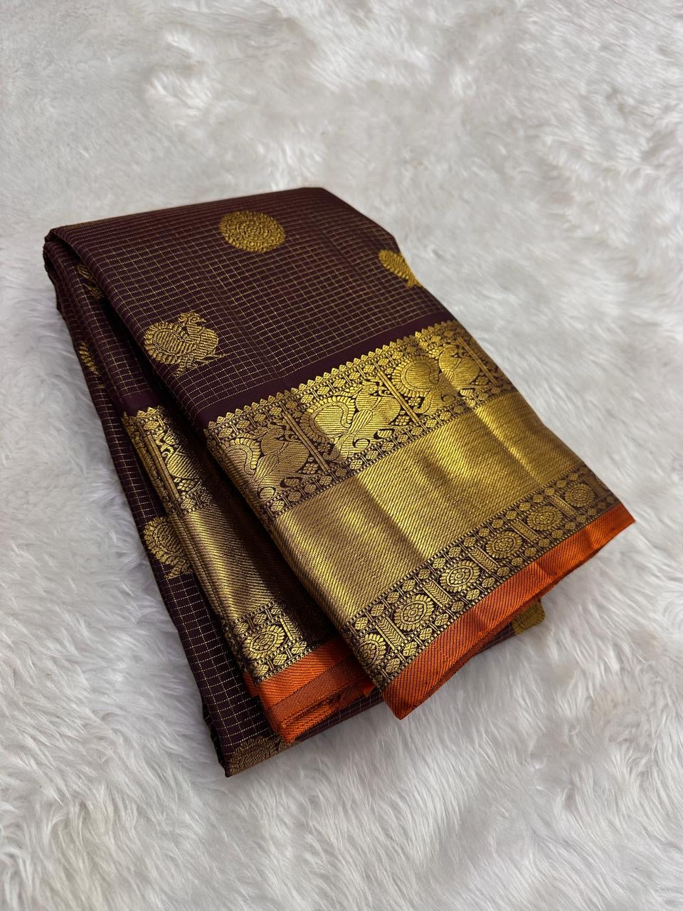 Deep brown pure Kanchipuram silk saree with Mayil Chakram Butta motifs and antique gold zari border
