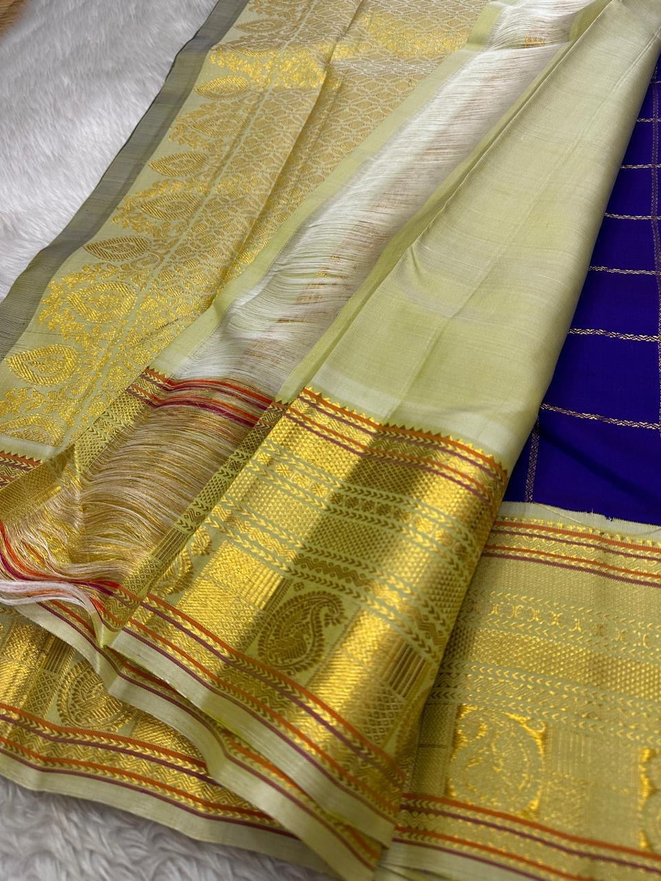 Amethyst Mayil Chakram – Pure Kanchipuram Silk Saree
Zari Kattam Checks with Peacock Motifs
Deep Violet Body with Golden Zari Detailing
Light Green Borders with Paisley Weaves

Silk Mark Certified, delivery in 2 weeks