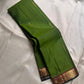 Varnam – Leaf Green Pure Kanchipuram Silk Saree with Gold Zari Buttas, Trellis Design Arakku Border, and Contrast Maroon Zari Pallu