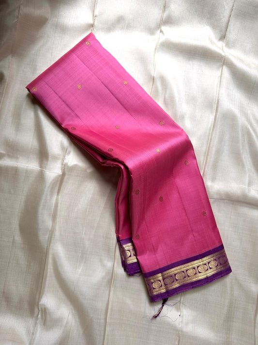 Varnam – Pastel Pink Kanchipuram Silk Saree with Lilac Purple Rudraksha Zari Border & Ornate Kamalam Pallu | Pure Handloom Heritage