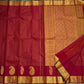 Ushas, Deep Arakku Red Pure Kanchipuram Silk Saree
Radiant Oosi Kattam body with ornate Paisley 2gm Zari
Vanasringaram,Muthuseer,Kamalam border with Fishpettu detailing
Exquisite diamond-pet grid Zari pallu, richly finished with a bold deep green selvedge