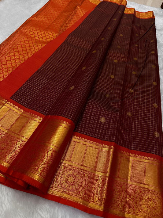 Pure silk kanchipuram a unique coffee deep brown and brick red combination , flower butta on zari checks