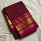 Arakku Kattam Mayura Chakram – Pure Silk Kanchipuram Saree (Maroon & Rani Pink)

Micro-check body with tiny gold buttas; vibrant rani contrast

Antique-gold peacock chakram border & grand woven zari pallu

Silk Mark Certified | Blouse Piece Included |