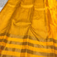 Kanaka – Sunlit Mustard Kanchipuram Silk Saree with Checked Zari Buttas and Gold Striped Border
A radiant weave that captures the warmth of tradition and the glow of celebration