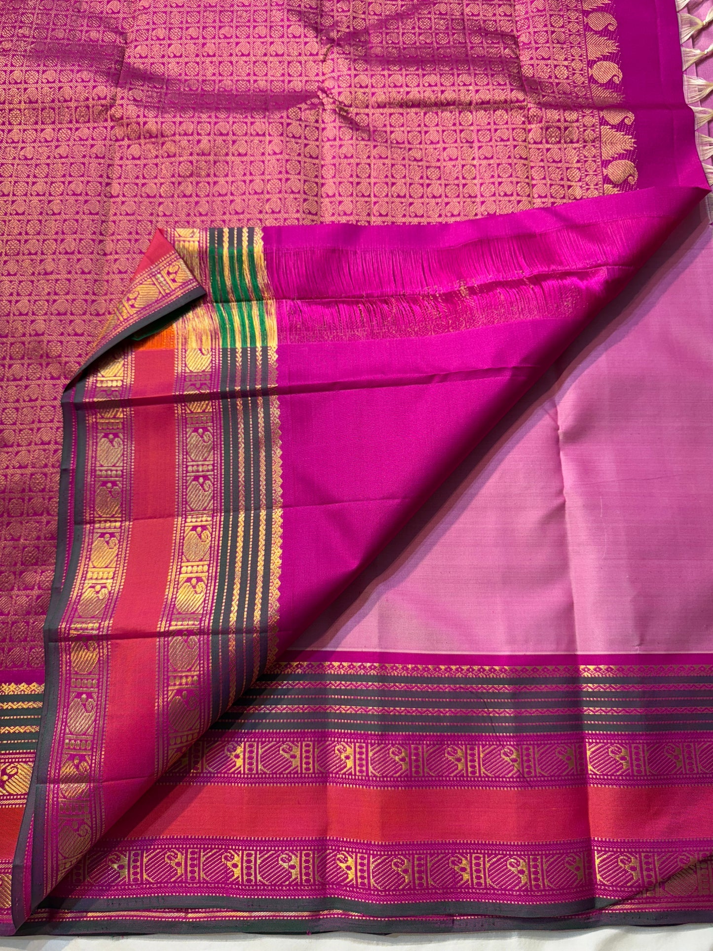 Pink Ombre Kanchipuram Pure Silk

Fuchsia Korvai Border • Charcoal stripes

Gold Zari Buttas (chakram & mango)

Rich zAri Pallu • Blouse included

Silk Mark Certified • Free USA Shipping • Ships in Two Weeks

— Pink Ombre Butta Korvai