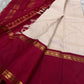 Full saree spread showing maroon pallu with gold zari stripes and tassels