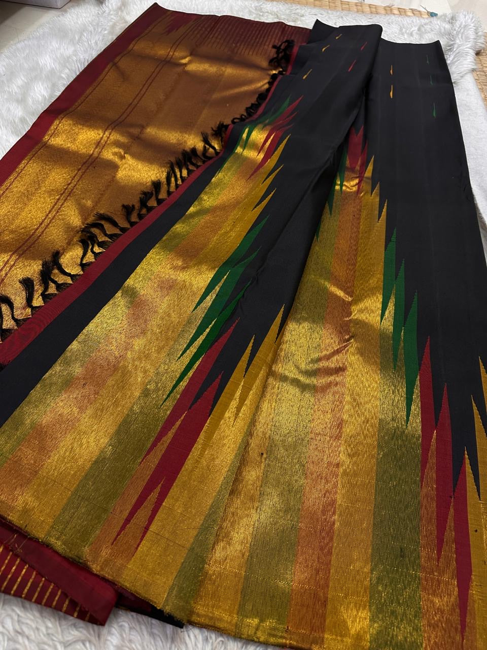 Kanchipuram silk saree layout displaying Ettukol flame motifs and rich zari detailing