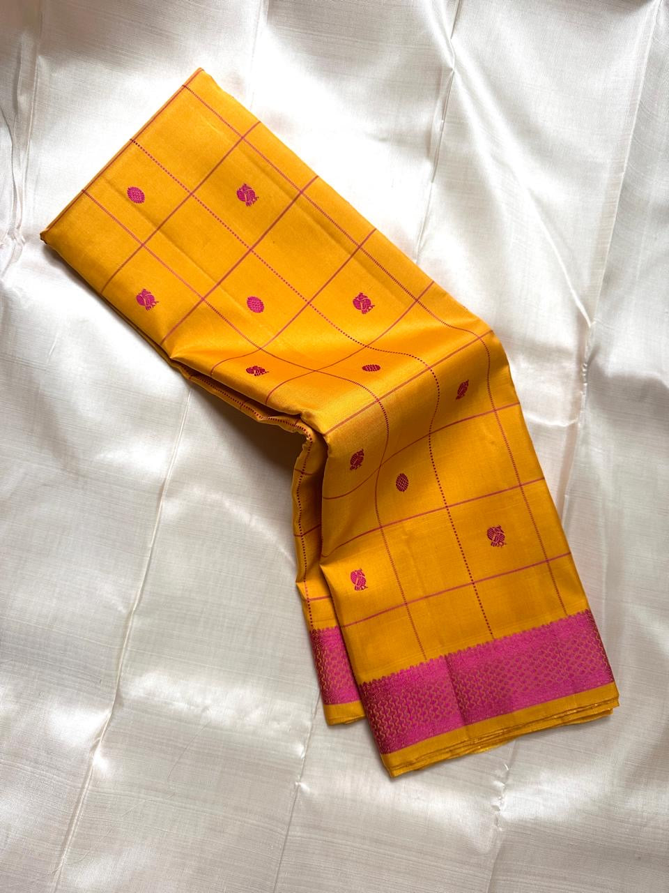 Marigold Pink Silk Thread — Pure Kanchipuram Silk
All-thread weave in marigold yellow with magenta kattam checks & buttas
Pink–orange zari woven pallu • Silk Mark Certified • Free Shipping USA