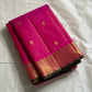 Rani Vairaoosi – Pure Kanchipuram Silk 💗

Fine Pinstriped Weave with Gold Buttas ✨

Antique-Gold Zari Border & Green Selvedge 🌿

Grand Zari Brocade Pallu with Medallion Checks 🪔

Silk Mark Certified • Ships in Two Weeks • Free USA Shipping