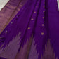 Sampoorna – Royal Purple Kanchipuram Pure Silk Saree
A regal drape in deep purple, adorned with silver and gold zari buttas. Finished with a stunning thazampoo reku border, this saree blends tradition with timeless grace.