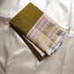 Luminous Lemon-Olive Green — White Korvai Kanchipuram

Pure Silk | Vairaoosi Checks | Korvai Contrast Borders

Classic White & Gold Pallu with Coin Jaal Motifs

Perfect for Muhurtham, Haldi & Temple Occasions

Silk Mark Certified | Free Shipping | Shi