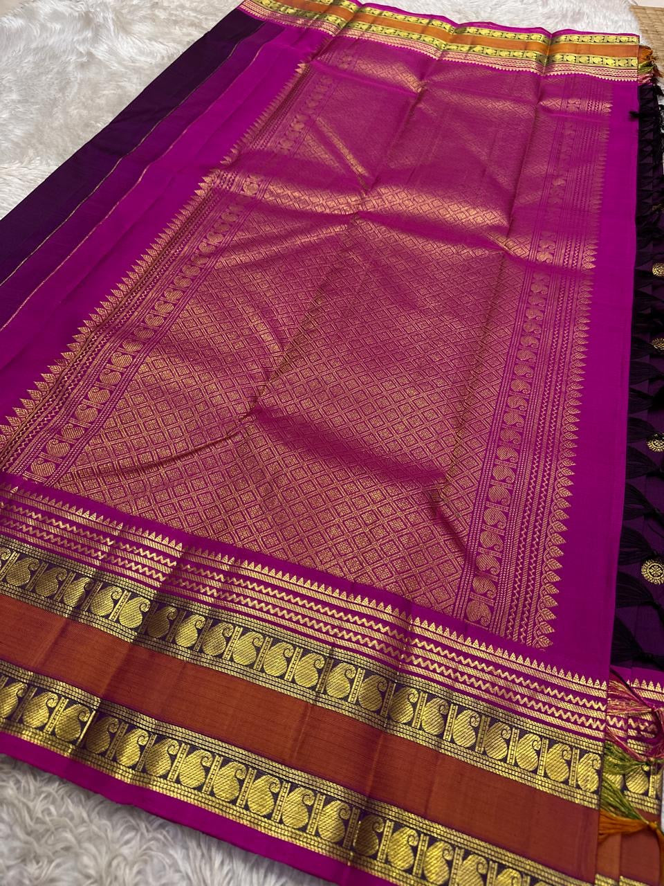 Kavyashree Plum Lustre — Pure Kanchipuram Silk Saree
Deep Plum Body with Gold Buttas, Rust–Magenta Korvai Borders
Silk Mark Certified | Free Shipping within USA | Ships in Two Weeks