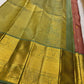 Vahini – Pleasant Peach Pink Pure Kanchipuram Silk Saree with Zari Kattam Checks, Silver & Gold Peacock Buttas, Sage Green Border Adorned with Kamalam Vines and Baavanji Motifs, and an Ornate Zari Pallu with Majestic Peacocks