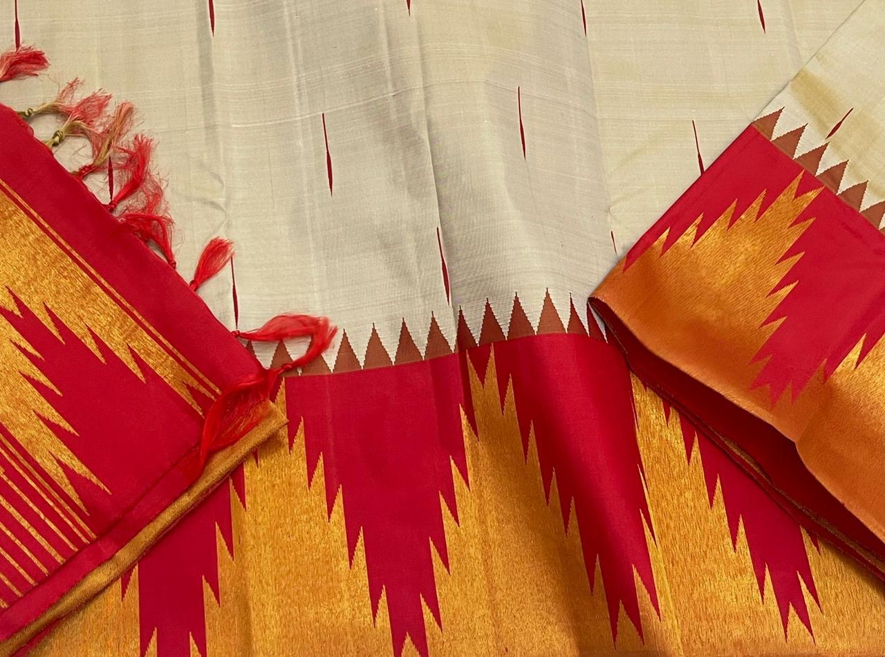 Vermillion Venpattu Ettukol — Pure Kanchipuram Silk 
Ivory venpattu body with fine red temple -motifs in ettukol weaving 

Vermilion-red &gold korvai temple (reku) borders

Mullai moggu woven motifs on body  

Silk Mark Certified | Free Shipping within US