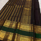 Twin gold zari registers and the contrasting silk interval forming a traditional Rettapet border