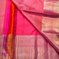 Peach Pink Flower Butta – Coral-pink shot body with micro checks & floral buttas

Handwoven Kanchipuram silk with delicate copper-pink zari work

Elegant floral vines on borders • grand rose-gold brocade pallu

Silk Mark Certified | Fall & Pico Done |