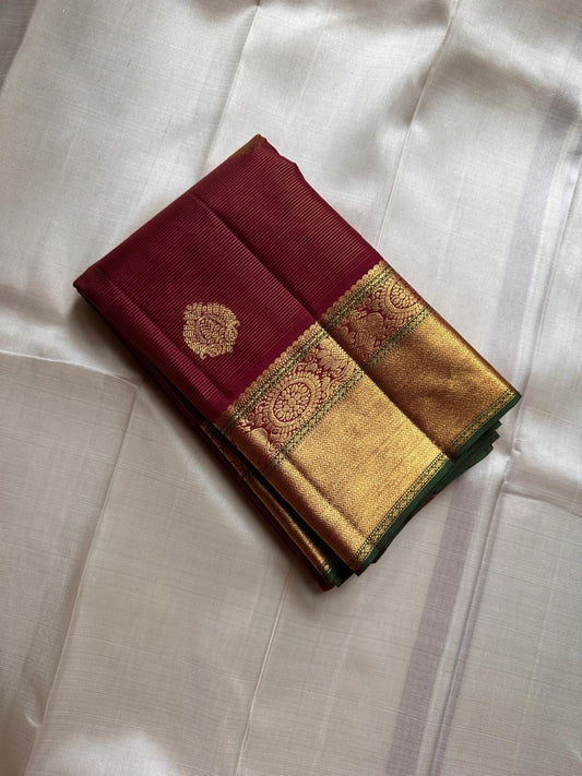 Burgundy Vairaoosi – Pure Kanchipuram Silk Saree
Classic burgundy body woven with Vairaoosi ✨
with delicate gold floral medallion buttas for temple elegance
antique-gold korvai borders with rosettes & chevron. Silk Mark Certified, delivery in 2 weeks