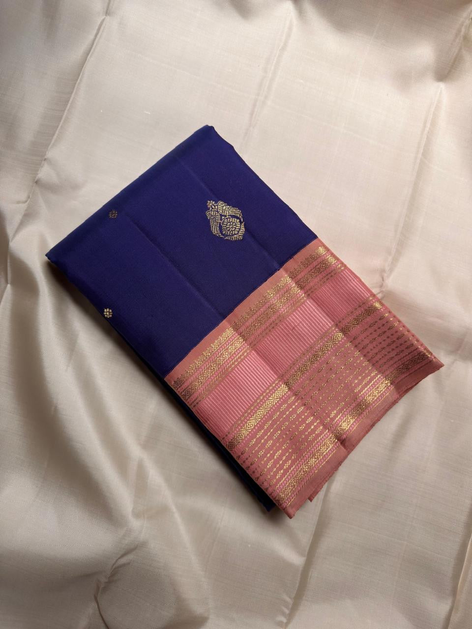 Double Kili motifs seated on Kamalam forms on royal blue Kanjipuram silk