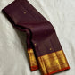 Deep Plum Orange
A regal dance of plum and burnt orange
Micro-checks kissed with golden buttas
Elephant borders marching in heritage grandeur
Brocade pallu glowing in timeless zari brilliance

Silk Mark Certified, delivery in 2 weeks