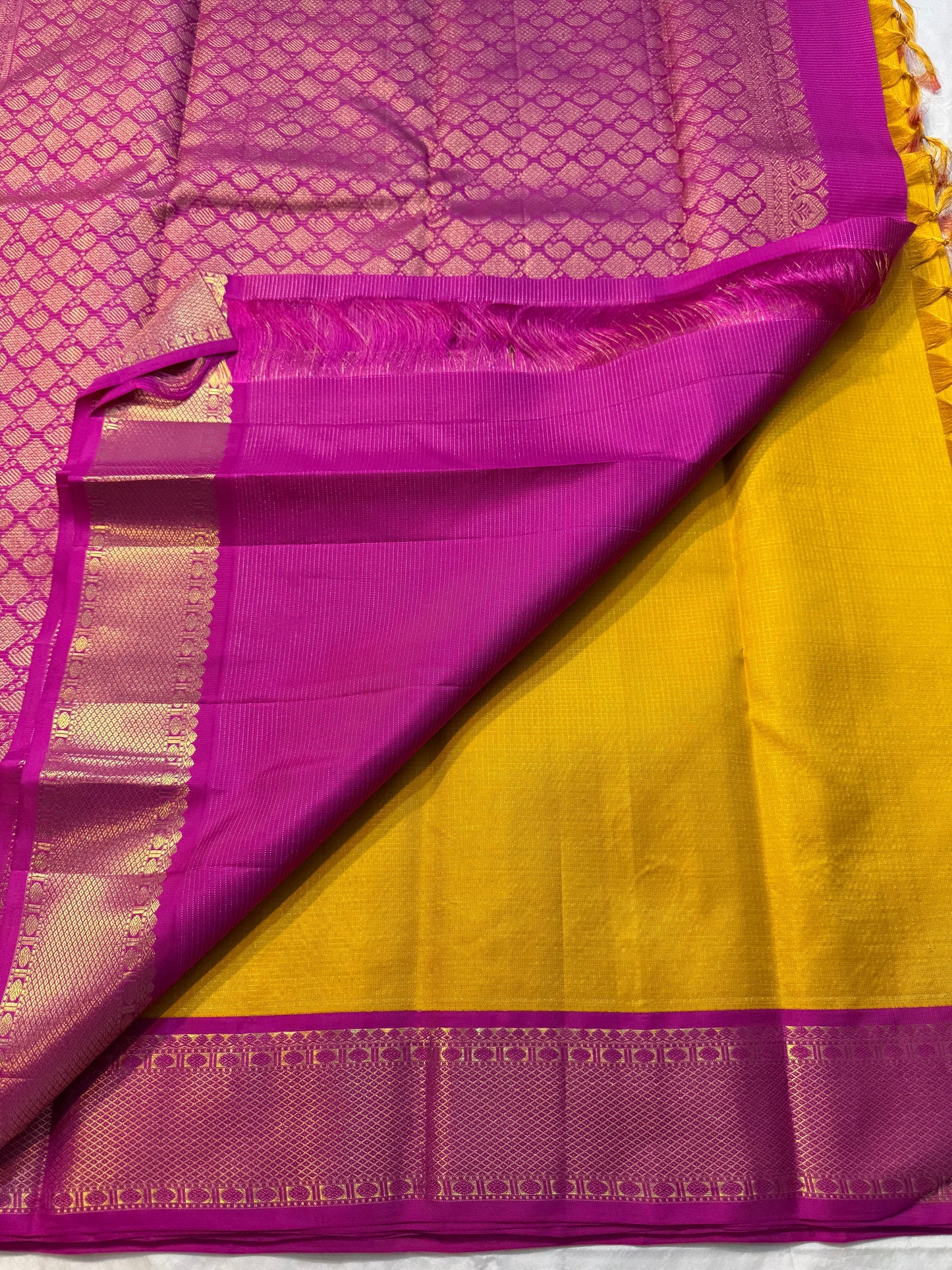 Ambar Rani — Pure Kanchipuram Silk Saree
Amber yellow oosi-kattam checks with contrast rani-pink korvai border and grand zari brocade pallu.
Silk Mark Certified • Free Shipping within USA • Ships in Two Weeks ✅