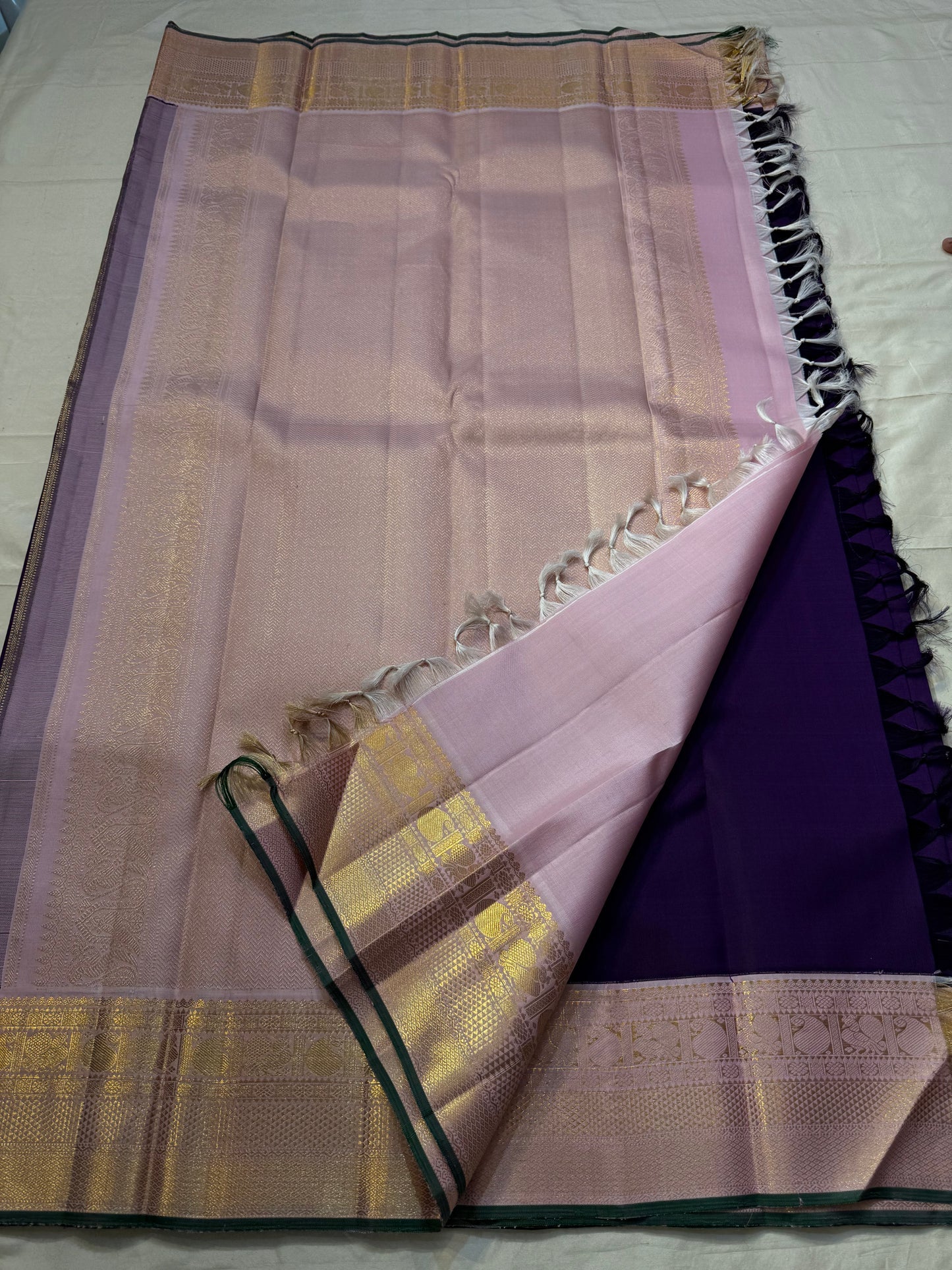 violet Sorgavasal mayil — Pure Silk Kanchipuram Saree
Deep violet body with antique-gold zari chakram buttas and petal-pink brocade mayil (peacock) borders
Silk Mark Certified ✅ • Ships in Two Weeks ✅ • Free Shipping within USA 🇺🇸
