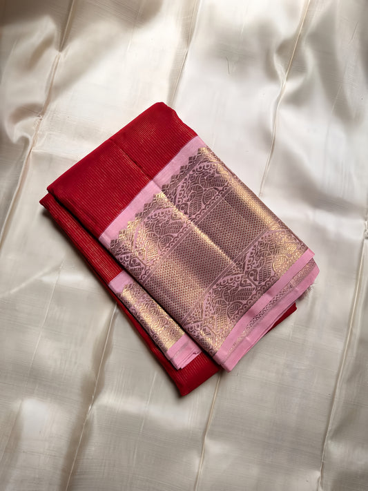 Pure silk vibrant chilli red body with   Zari kattam , pastel pink border with dual Peacocks on stambham Motifs - pure 3g zari ( certificate provided)