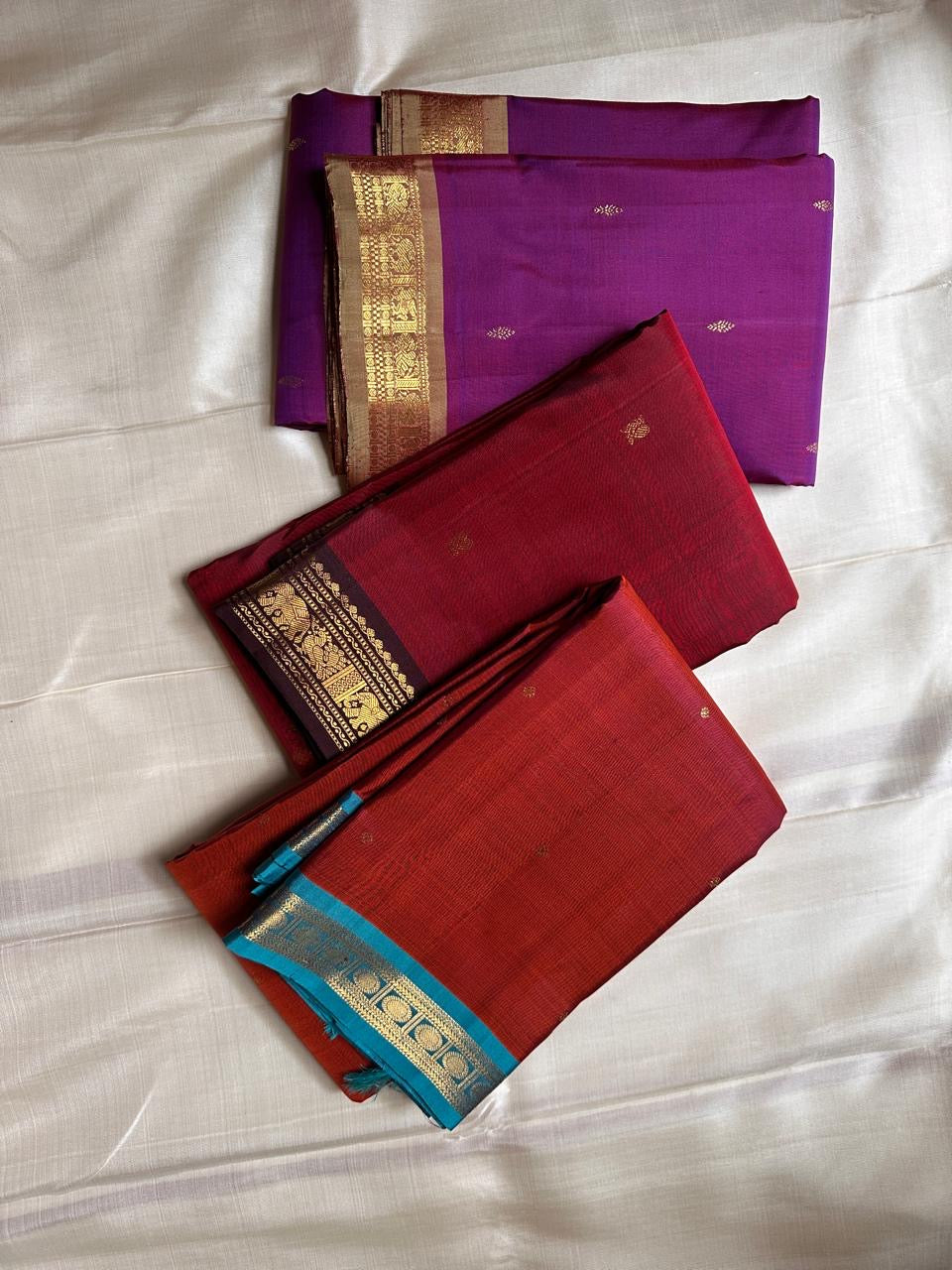Ember ✨
Pure Kanchipuram Silk Saree in Ember Red & Coffee Brown
Ember-red body with delicate gold zari buttas
Rich coffee-brown elephant border with zari vines

Silk Mark Certified, delivery in 2 weeks