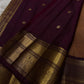 Pari is a graceful Kanchipuram pure silk saree in a serene copper-rose gold brown hue. Scattered peacock zari buttas .  Framed by an antique-gold korvai border temple-inspired yali, annam, and floral medallions, finished with a deep wine-maroon Pallu