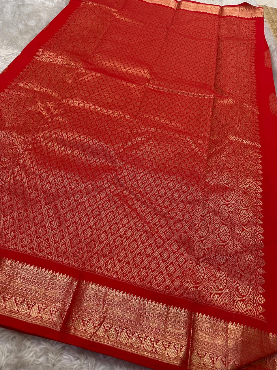 Thamarai Red — Pure Kanchipuram Silk Saree
Temple Red with Gold Zari Leaf Buttas & Diamond Jaal Pallu
Silk Mark Certified • Free Shipping within USA • Ships in Two Weeks