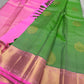 Asha ✨ – Fresh Green Pure Silk Kanchipuram Saree
with Radiant Pink Korvai Contrast Border
Gold Zari Floral Medallion Buttas on the Body
Grand Pink Brocade Pallu with Intricate Weaving