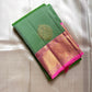 Asha ✨ – Fresh Green Pure Silk Kanchipuram Saree
with Radiant Pink Korvai Contrast Border
Gold Zari Floral Medallion Buttas on the Body
Grand Pink Brocade Pallu with Intricate Weaving