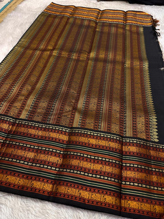 Ivory Varisaipet – Pure Kanchipuram Silk Saree
Pattunool Kattam Checks on Ivory Base
Black Borders with Elephant & Floral Motifs
Antique Gold, Rust & Bottle-Green Stripes

Silk Mark Certified, delivery in 2 weeks
