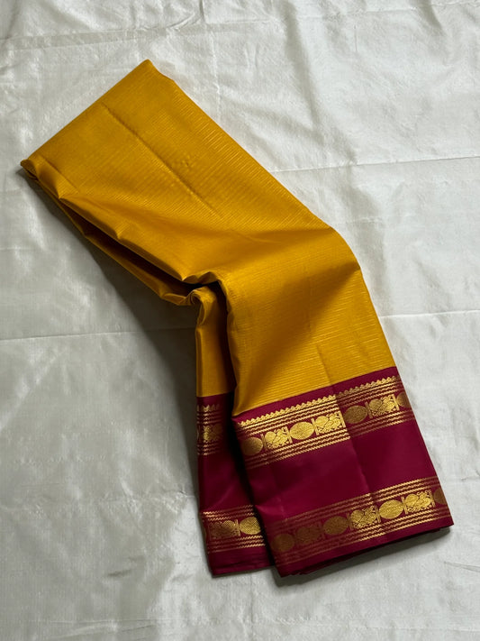 Swarna Manjal vairaoosi 
Pure Silk Kanchipuram Saree – Radiant Mustard Yellow Body with Maroon Border & Grand Brocade Pallu
Silk Mark Certified ✅
Fall & Pico Done ✅ | Blouse Stitching Available ($30) ✅
Free Shipping within the USA ✅ | Ships in Two Weeks ✅