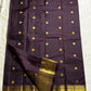 Nagavalli – A Midnight Jamun Dream in Kanchipuram Silk, Woven with Gold Coin Buttas, Temple-Inspired Arai Maadam Border, and Rudhraksham Seer in Lustrous Zari