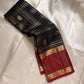 Kanmani Karuppu Kattam Ruby – Pure Kanchipuram Silk Saree
Deep black body with gold kattam checks & peacock buttas
Contrast ruby-red korvai borders
Grand ruby-red pallu with floral & lattice zari motifs
Silk Mark Certified | ships in 2 weeks