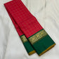 Emerald Ruby Korvai
Pure Kanchipuram Silk Saree – Ruby Red Body with muthu kattam  Grid Checks
Emerald Green Korvai Borders Adorned with Zari Elephant Motifs
Grand Green Zari seer Pallu with Traditional motifs 
Silk mark certified, ships in 2 weeks