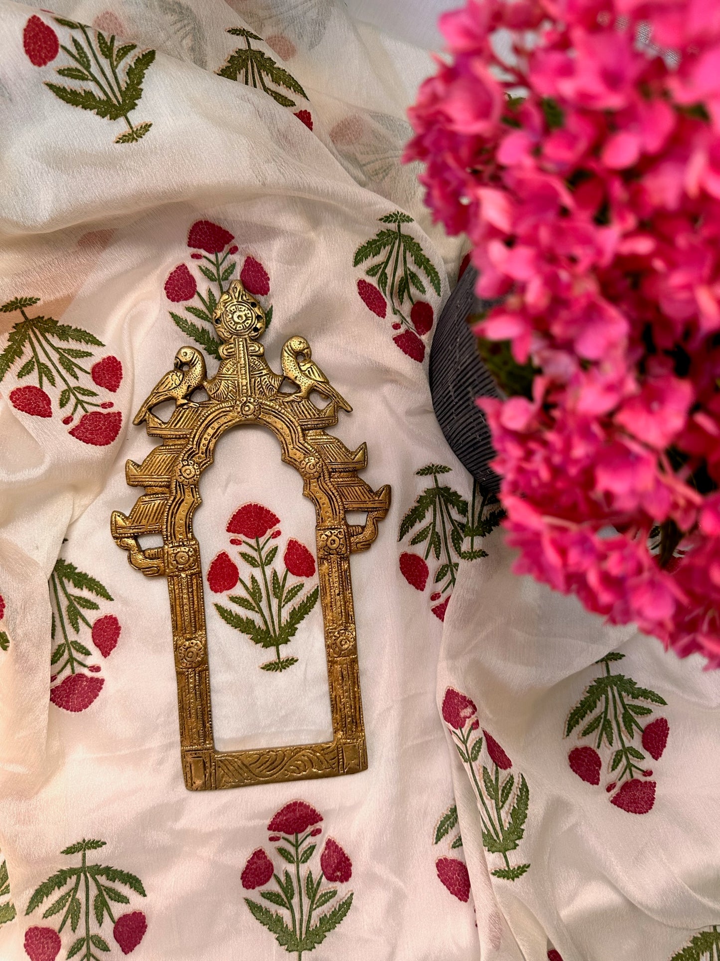 Traditional pure brass prabhavali frame featuring carved peacock motif and detailed ornamental arch