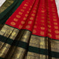 Full view of sindoor red Kanchipuram silk saree with gold buttas and temple-style green zari border