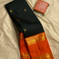 Divya – Handwoven Black Kanchipuram Pure Silk Saree with Mayil & Floral Butta, Finished with a Bold Rettapettu Border