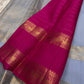 Fuchsia in Sky – Pure Silk Kanchipuram Saree
Sky Blue Body with Gold Kattam Checks & Petite Buttas
Fuchsia Contrast Petni Pallu with Zari Reku Stripes
Wide Gold Zari Border with Peacock & Temple Motifs
Silk mark certified, ships in 2 weeks